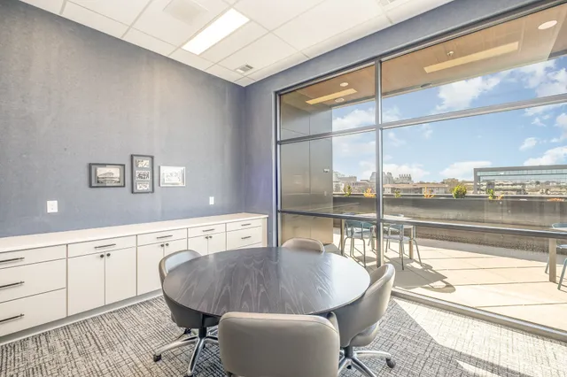 a room with gym equipment and a large window