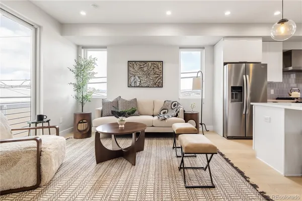 a living room with furniture and a table