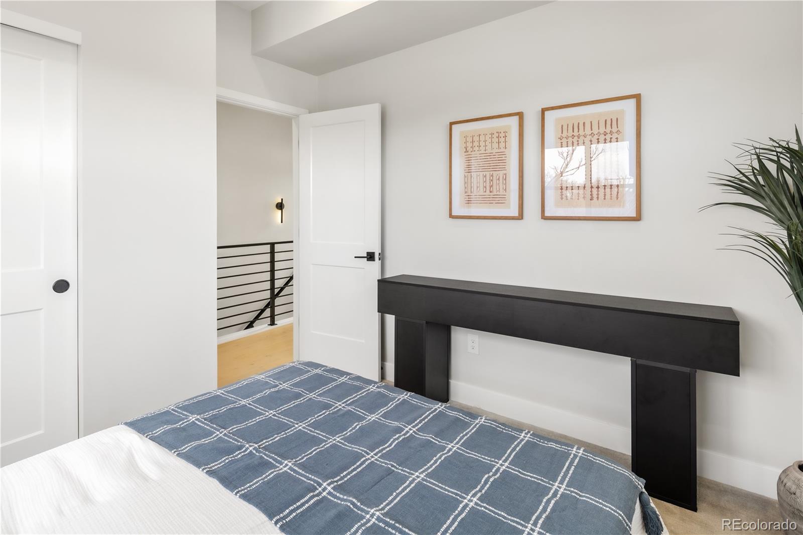 1467 Locust Street Denver, CO 80220 - Photo 19 of 23 a bedroom with a bed and a window