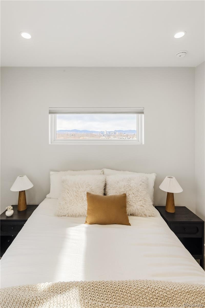1467 Locust Street Denver, CO 80220 - Photo 2 of 23 a bedroom with a bed and window