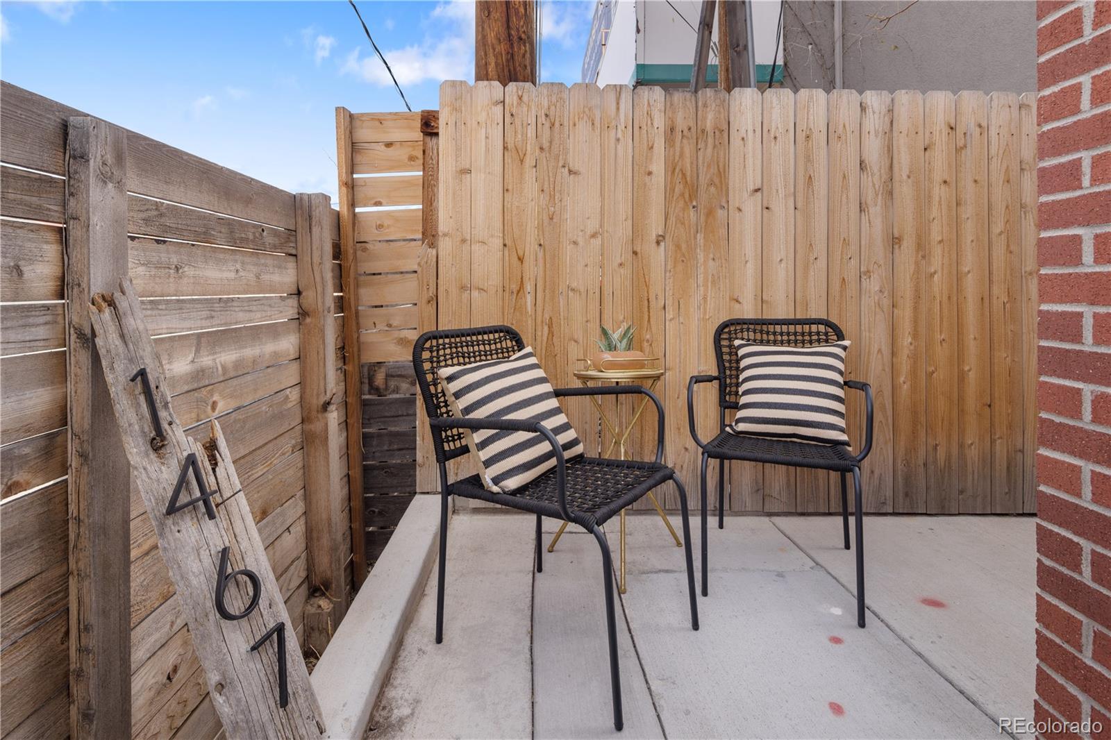 1467 Locust Street Denver, CO 80220 - Photo 21 of 23 a balcony with chairs and wooden floor