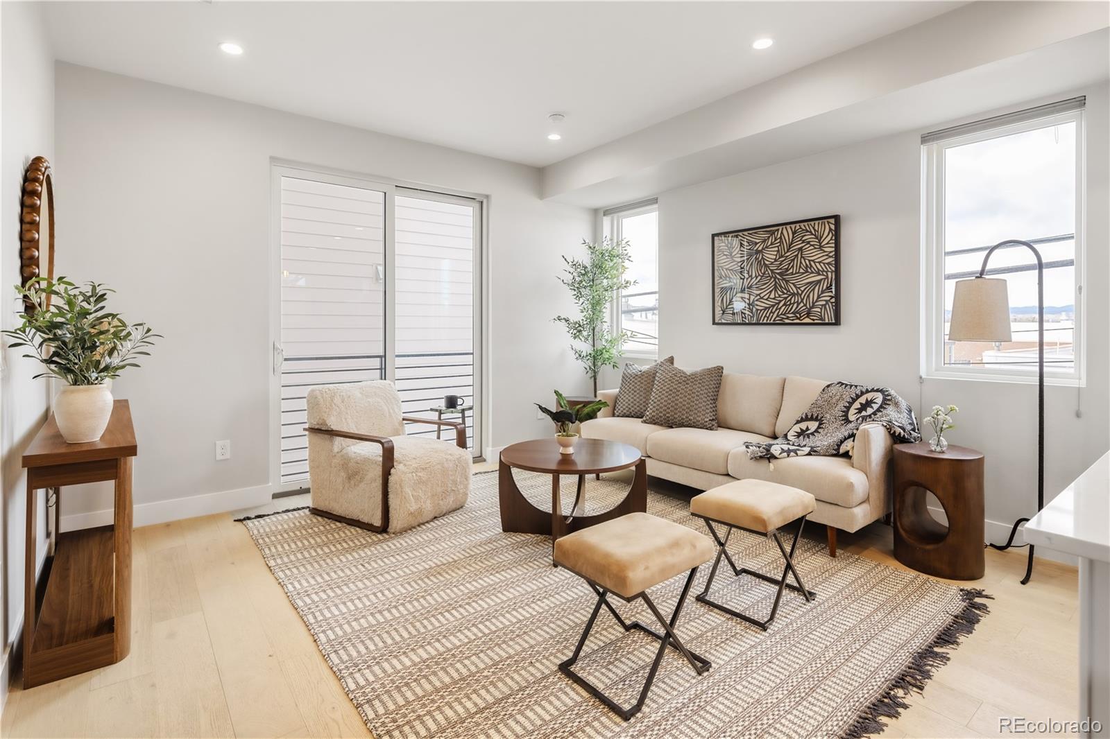 1467 Locust Street Denver, CO 80220 - Photo 3 of 23 a living room with furniture and a potted plant