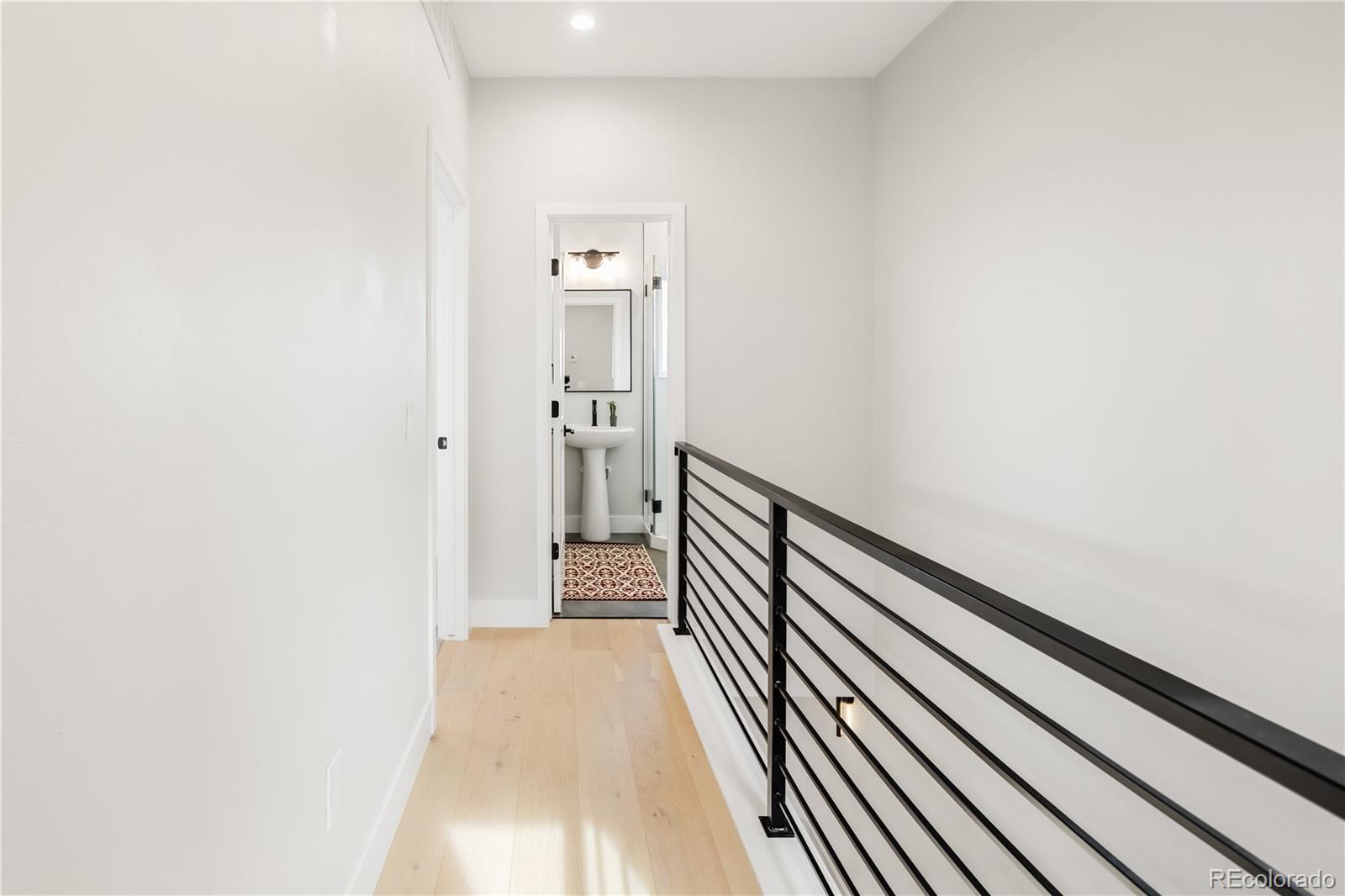 1467 Locust Street Denver, CO 80220 - Photo 8 of 23 a view of a hallway with wooden floor