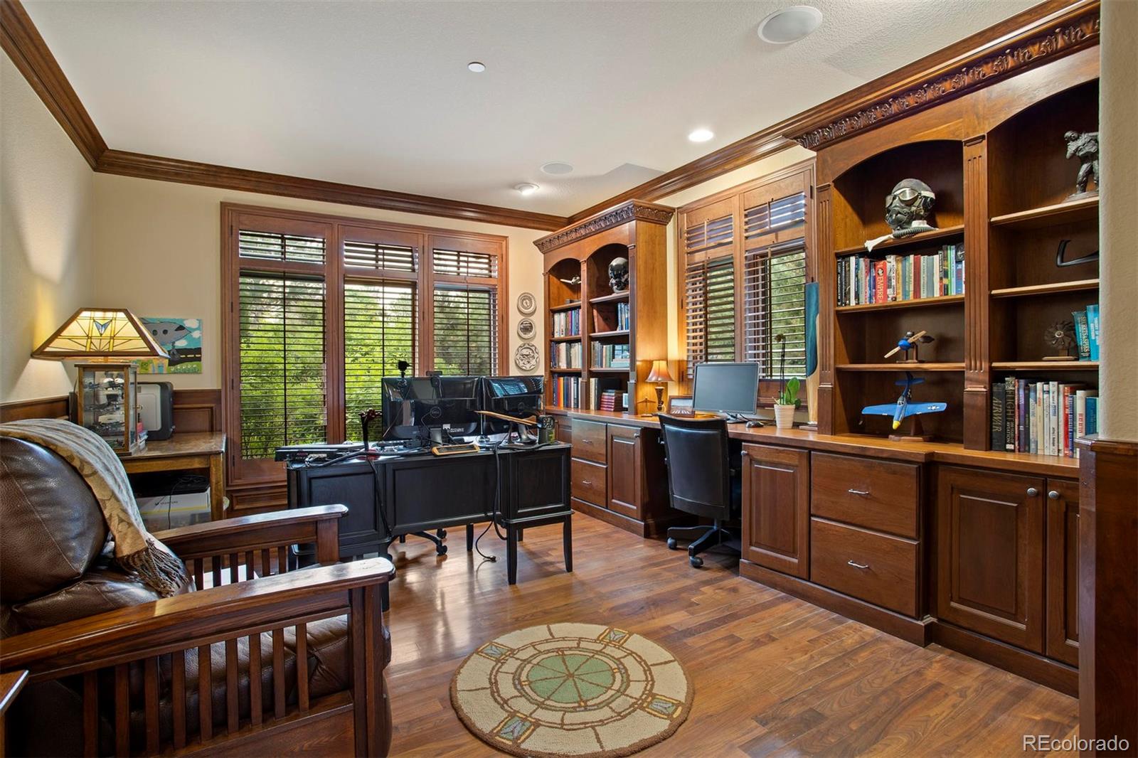 648 Ruby Trust Drive Castle Rock, CO 80108 - Photo 15 of 40 a living room with furniture a bookshelf and a window