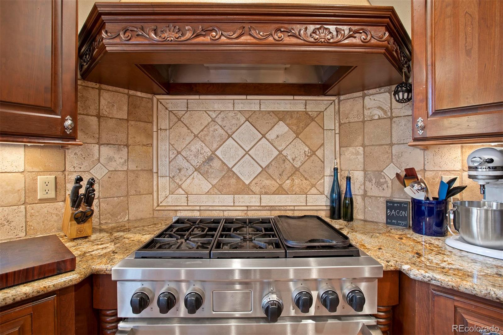 648 Ruby Trust Drive Castle Rock, CO 80108 - Photo 10 of 40 a stove top oven sitting inside of a kitchen