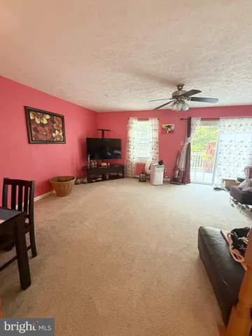 a bed room with furniture and a large window