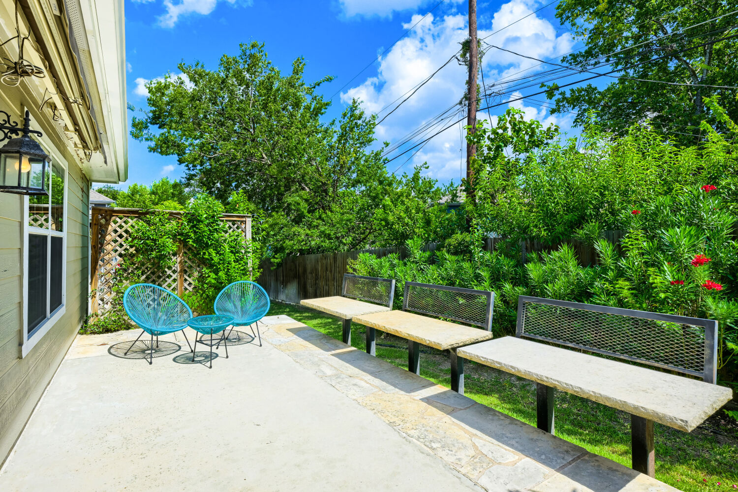 6715 Windrift Way, Unit 28 Austin, TX 78745 - Photo 4 of 19 Custom built outdoor patio offers a private setting surrounded by lush greenery.