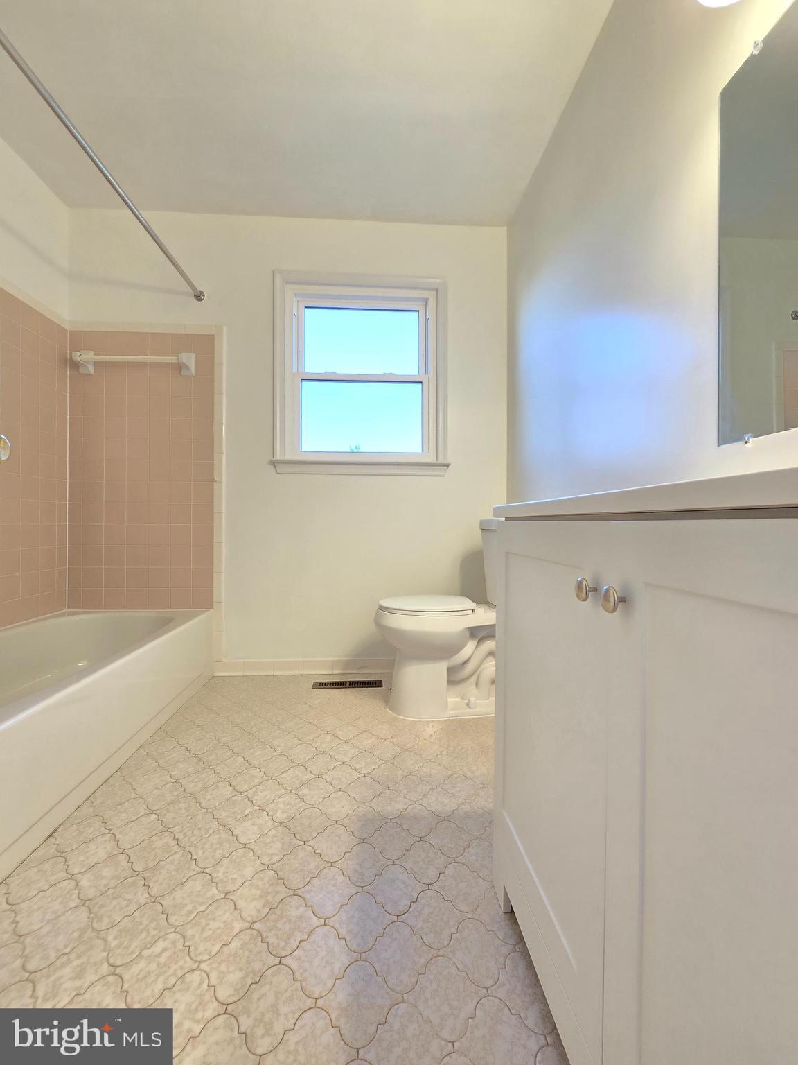 1113 Mirga Circle Baltimore, MD 21207 - Photo 20 of 23 a bathroom with a toilet a sink and bathtub