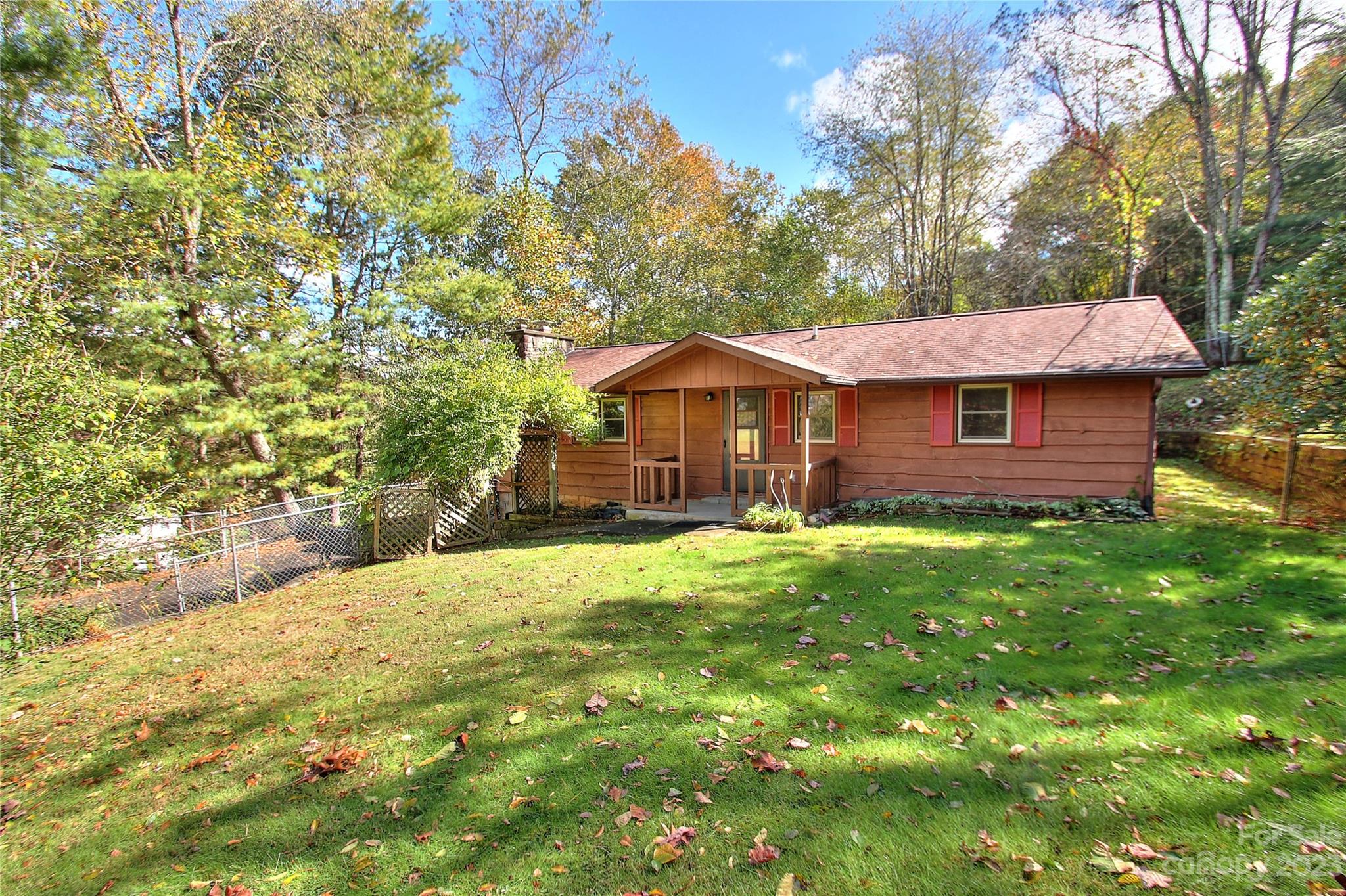 2872 Hyder Mountain Road Clyde, NC 28721 - Photo 1 of 29 a front view of a house with yard and green space