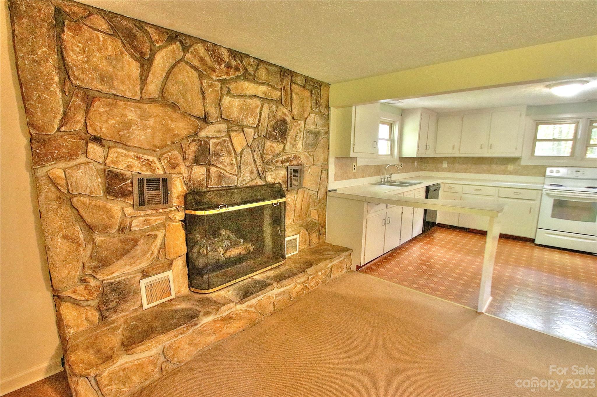 2872 Hyder Mountain Road Clyde, NC 28721 - Photo 5 of 29 a large white kitchen with a large window