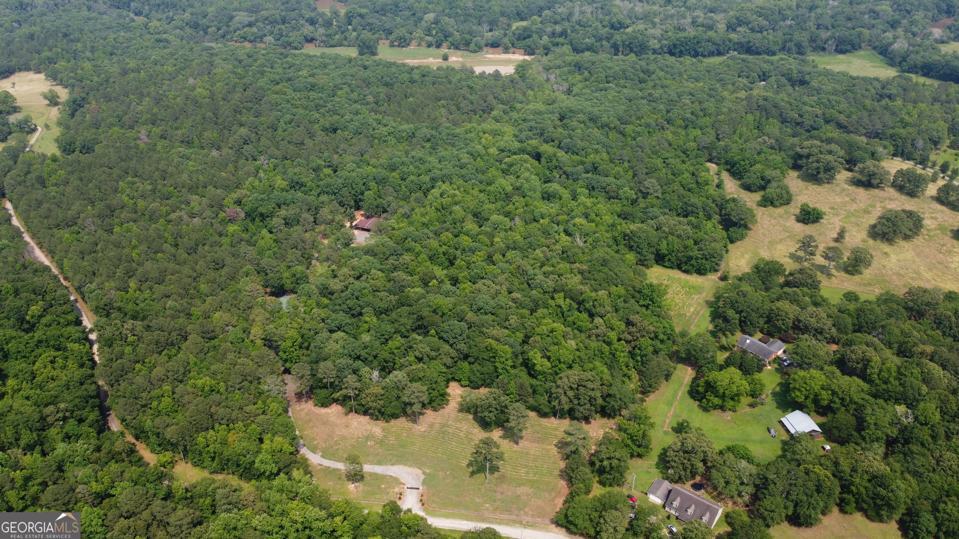 1520 Marshall Wilkes Road Watkinsville, GA 30677 - Photo 13 of 47 a backyard of a house with lots of green space and mountain view