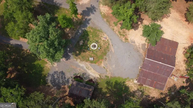 an aerial view of a house with a yard