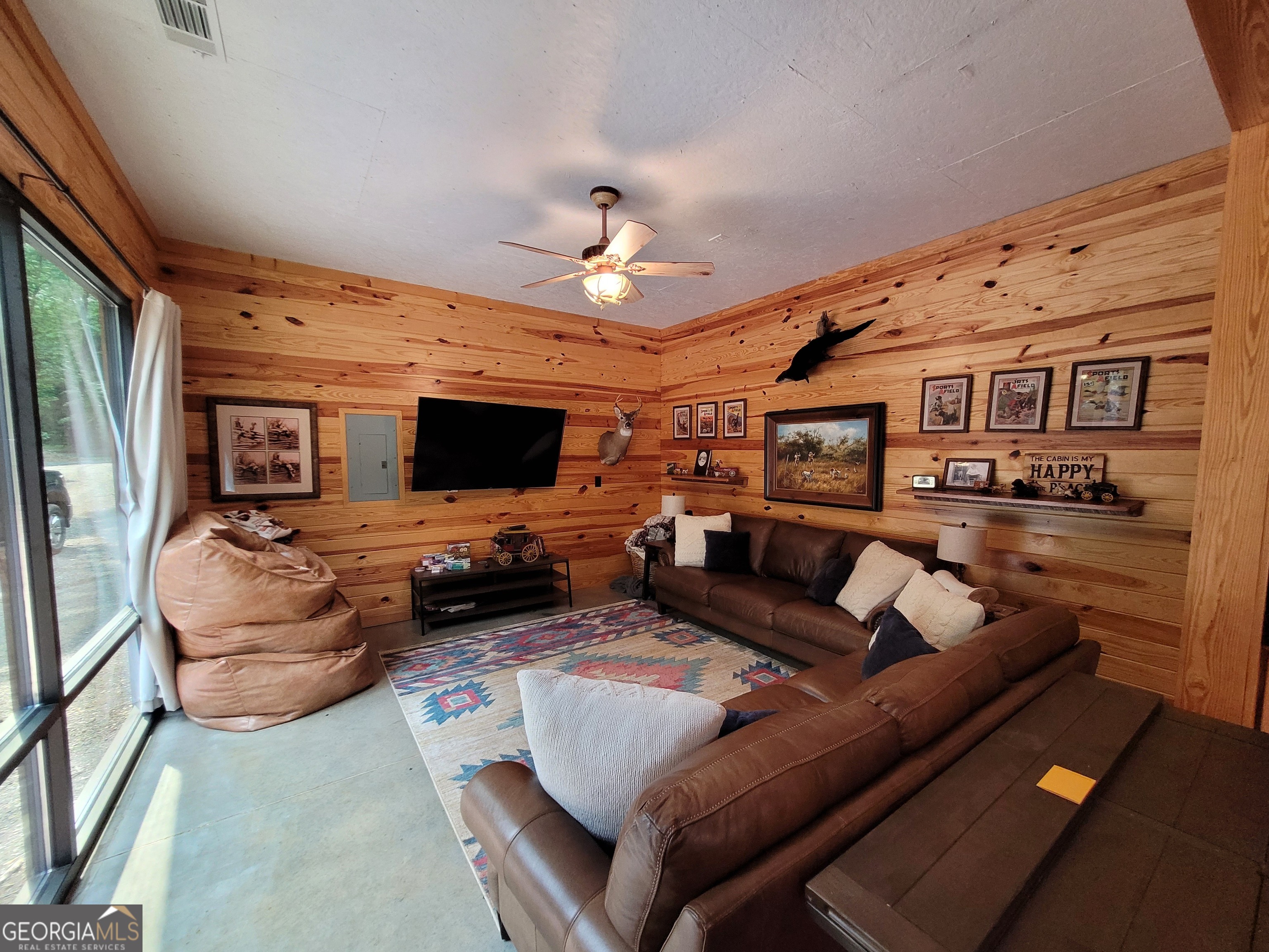 1520 Marshall Wilkes Road Watkinsville, GA 30677 - Photo 27 of 47 a living room with furniture a flat screen tv and kitchen view