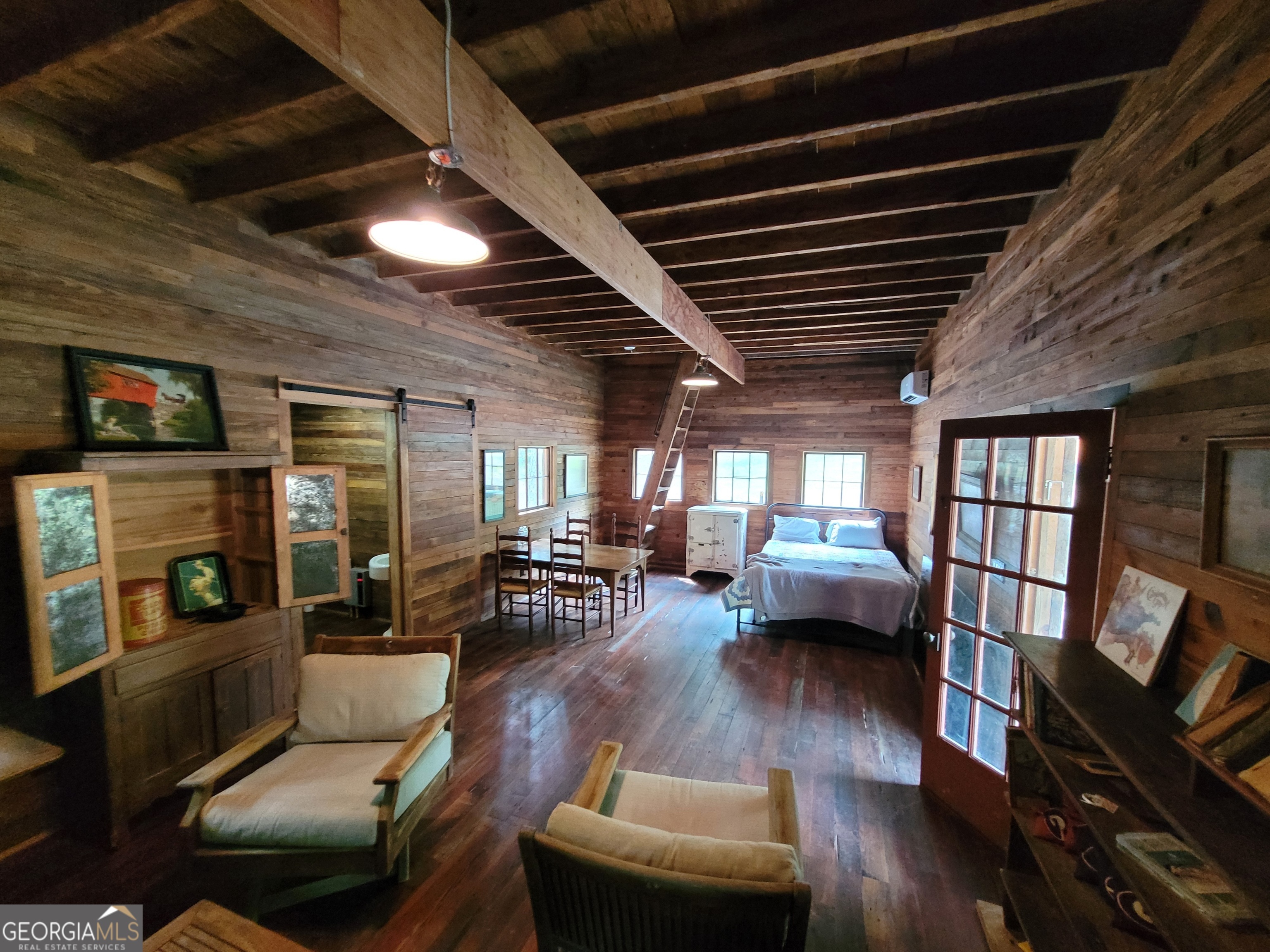 1520 Marshall Wilkes Road Watkinsville, GA 30677 - Photo 33 of 47 a living room with furniture or couch and a flat screen tv