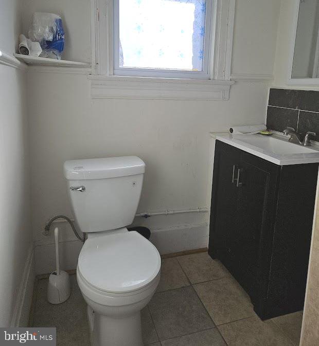 1648 Columbia Road Northwest, Unit B Washington, DC 20009 - Photo 13 of 15 a bathroom with a toilet sink and mirror