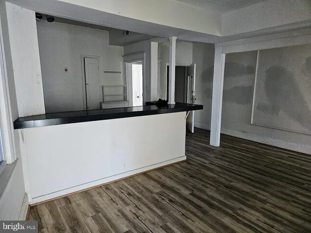 a large kitchen with a stove a sink and dishwasher