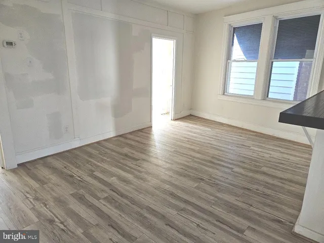 a living room with wooden floor