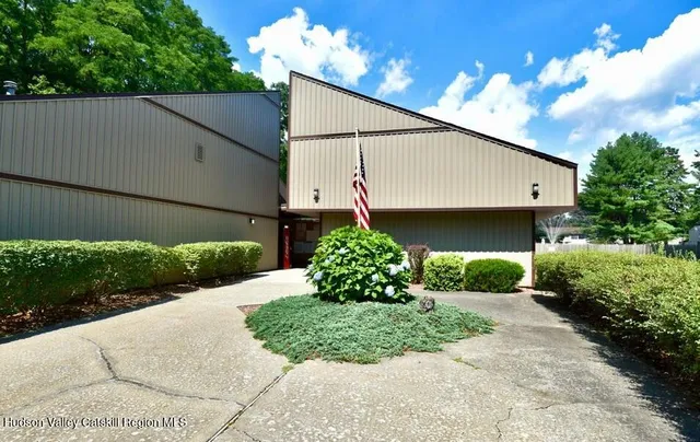 a view of a swimming pool with chairs