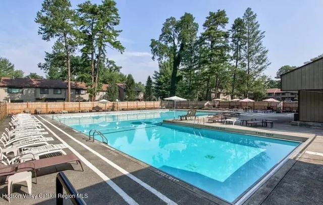 a backyard of a house with yard barbeque oven and outdoor seating