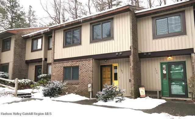 a view of a balcony with table and chairs
