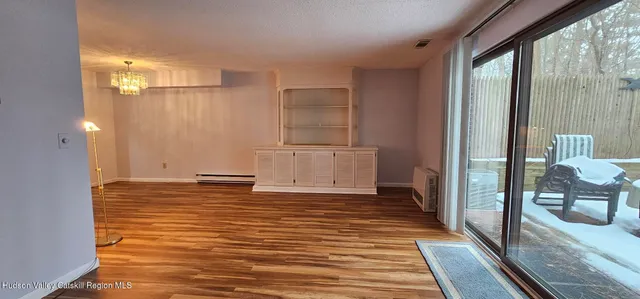 a view of an empty room with closet area