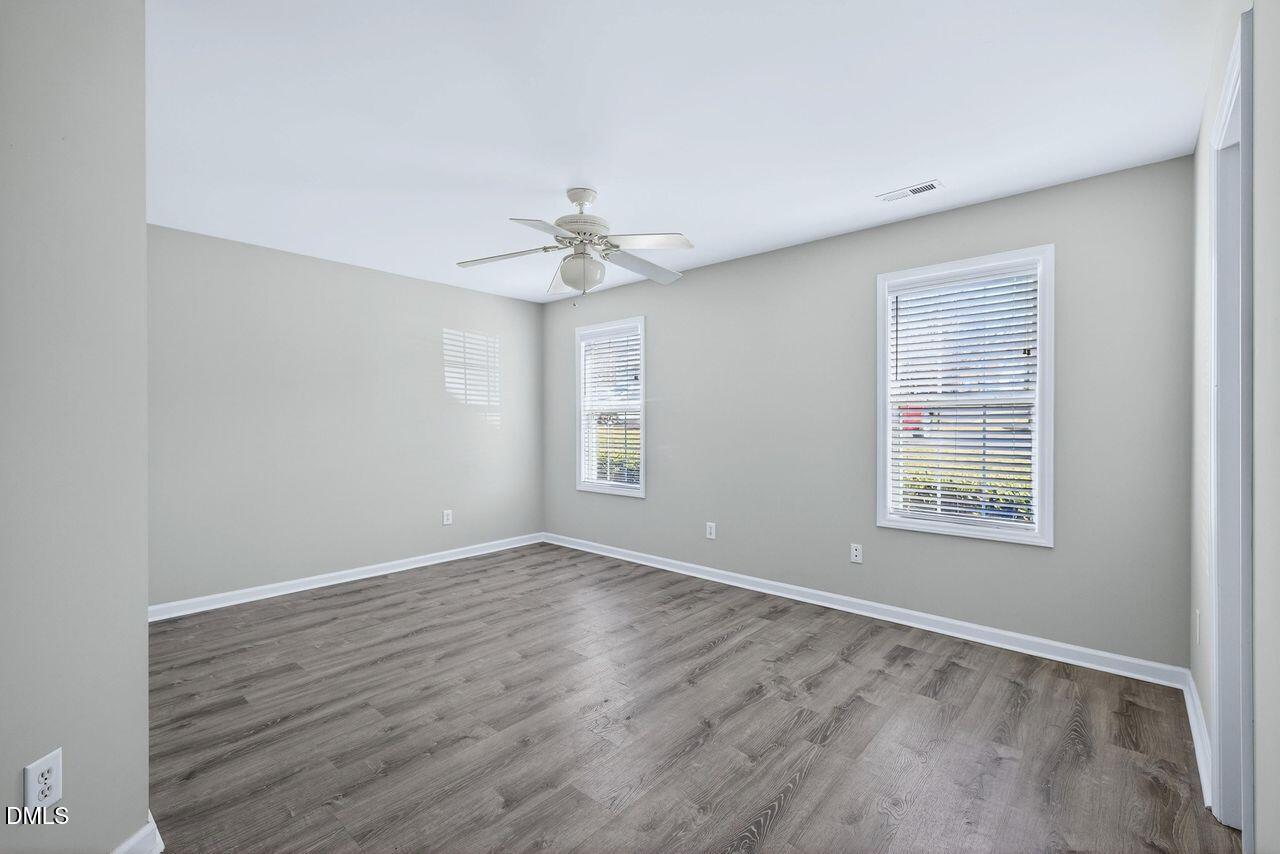 3413 Wellington Ridge Loop Cary, NC 27518 - Photo 11 of 12 a view of an empty room with a window