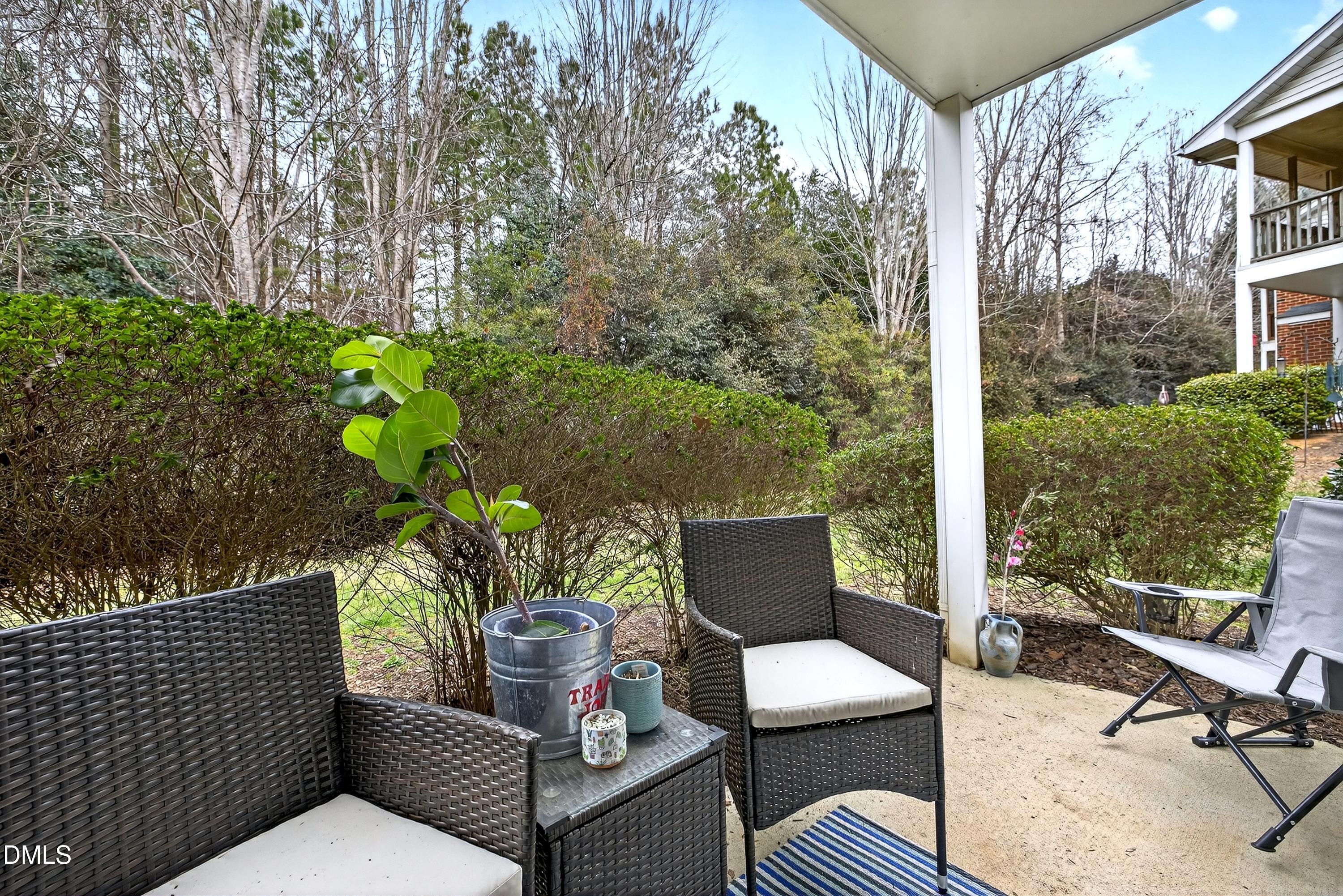 3413 Wellington Ridge Loop Cary, NC 27518 - Photo 4 of 12 a outdoor living space with furniture and garden view