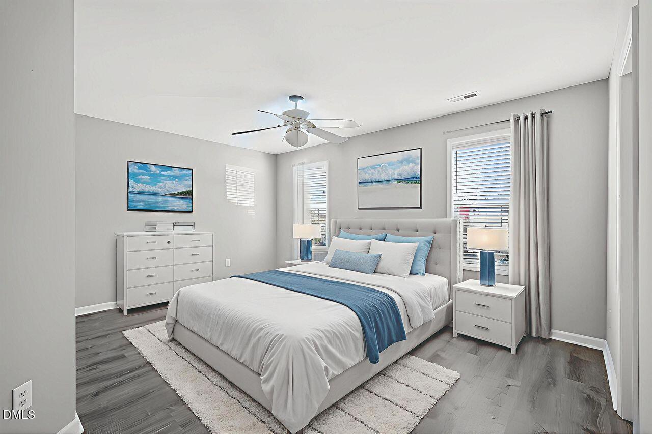 3413 Wellington Ridge Loop Cary, NC 27518 - Photo 10 of 12 a bedroom with a large bed and a window
