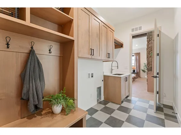 a bathroom with a sink mirror vanity and toilet
