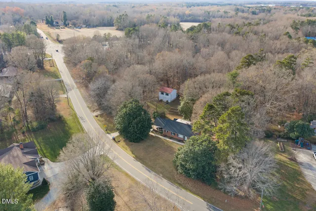 an aerial view of residential house with outdoor space