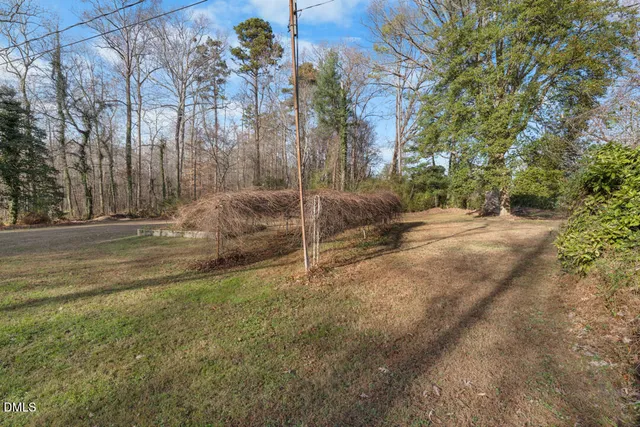 a backyard of a house with lots of green space