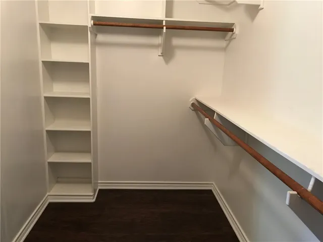 a view of an empty walk in closet