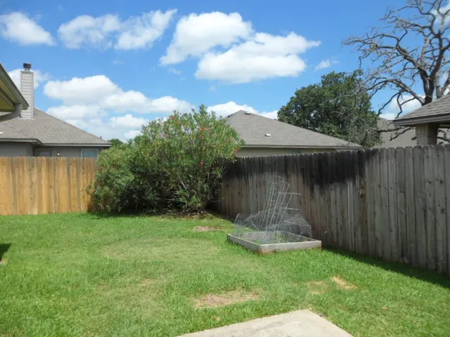 a view of a back yard of the house