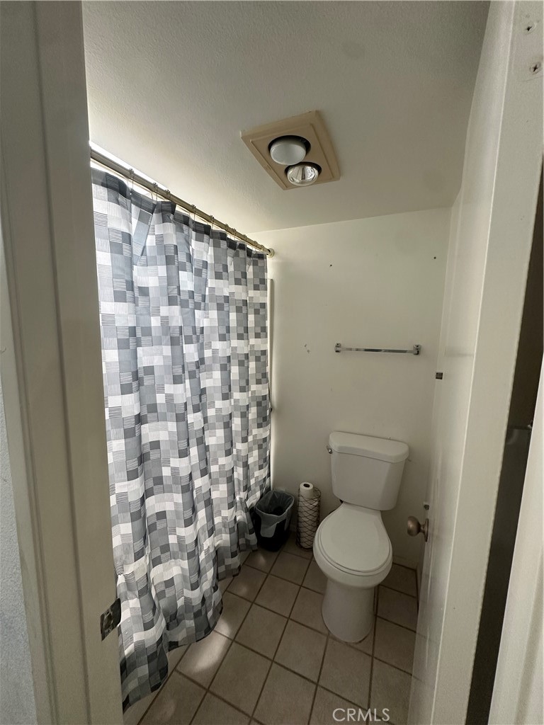 18223 Soledad Canyon Road, Unit 45 Canyon Country, CA 91387 - Photo 5 of 24 a bathroom with a toilet and a shower
