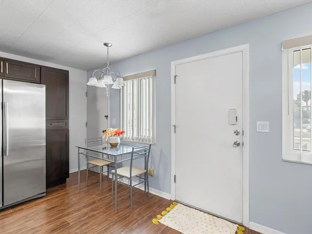 a room that has a table and a chair in it