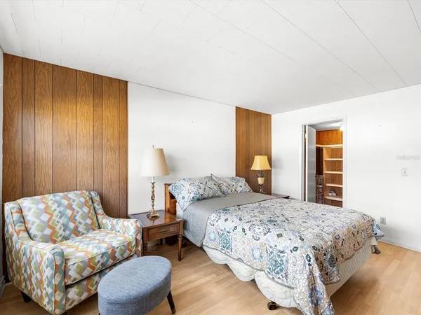 a bedroom with a bed and a couch