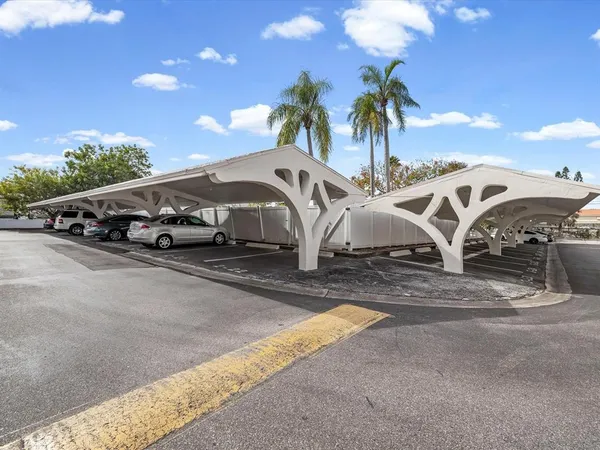 a room with pool table and windows
