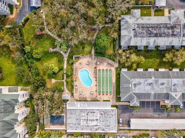 a view of swimming pool with a chairs