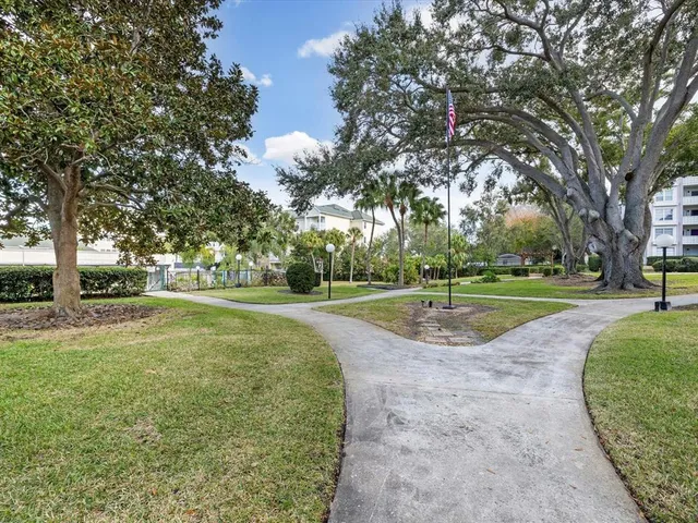 a view of a house with pool and chairs