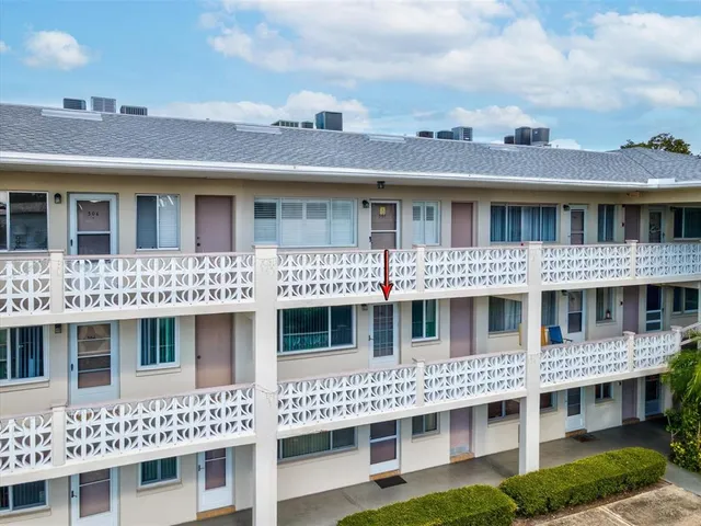 a swimming pool view with a outdoor seating space