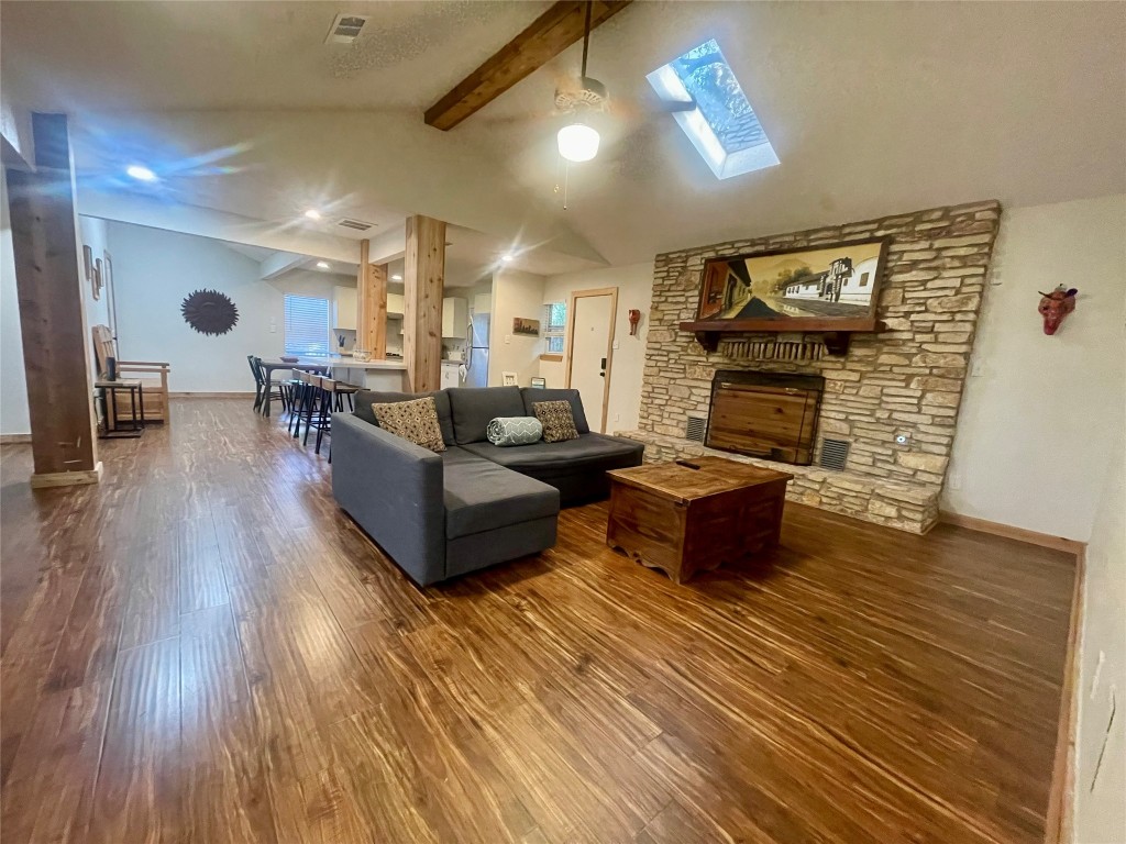 17357 West Beach Road Austin, TX 78734 - Photo 14 of 32 a living room with furniture and a fireplace