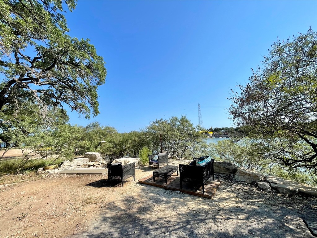 17357 West Beach Road Austin, TX 78734 - Photo 24 of 32 a view of a couch in a backyard of a house