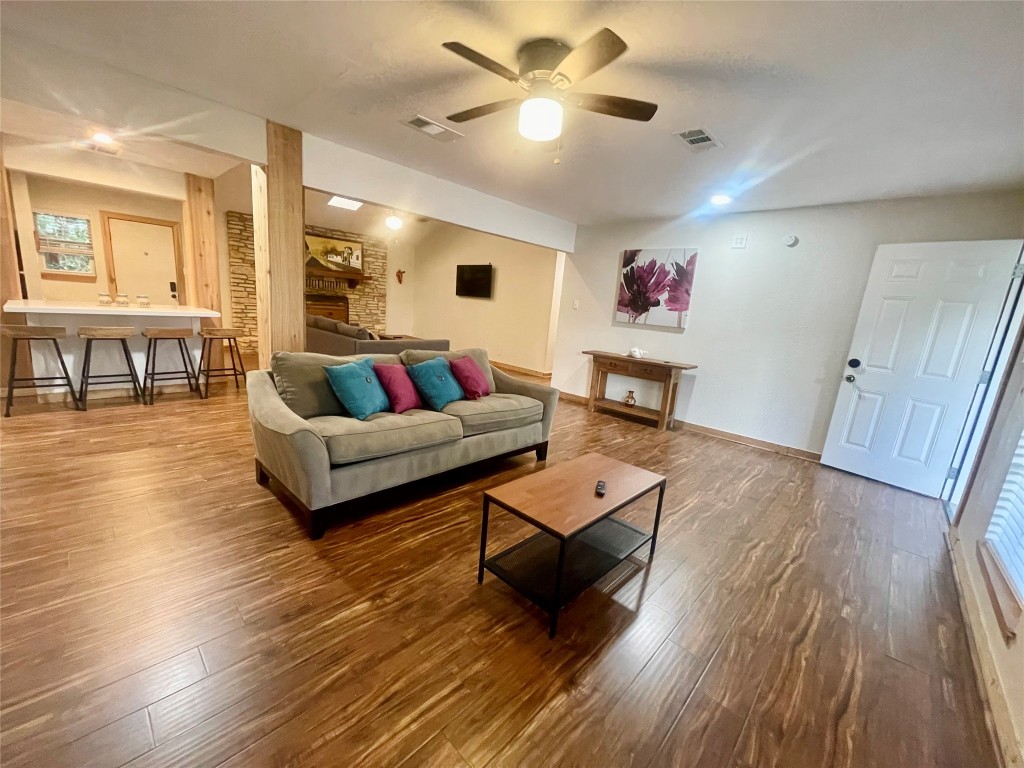 17357 West Beach Road Austin, TX 78734 - Photo 3 of 32 a living room with furniture and a wooden floor