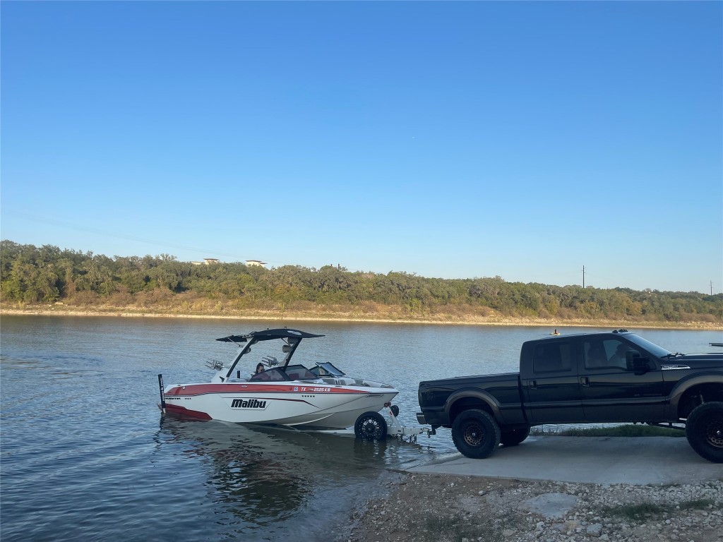 17357 West Beach Road Austin, TX 78734 - Photo 31 of 32 a view of a lake with furniture