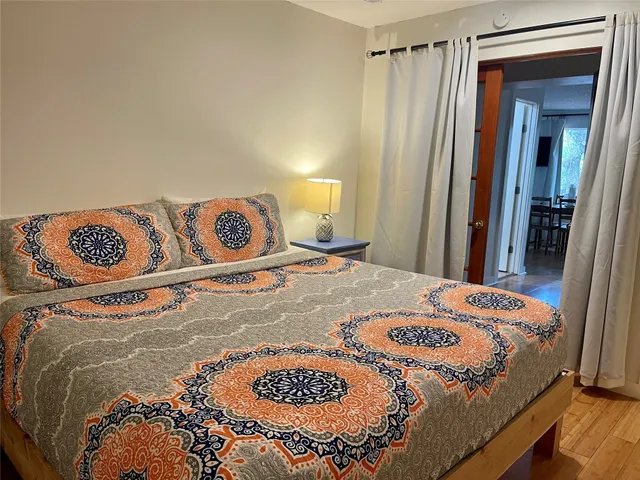 a bedroom with a bed and a dresser