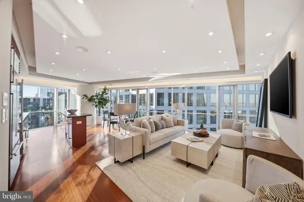 a living room with fireplace furniture and a flat screen tv