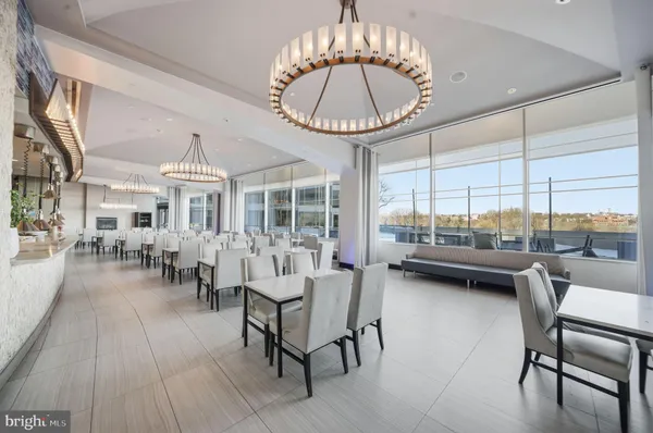 a room with lots of chairs and a table