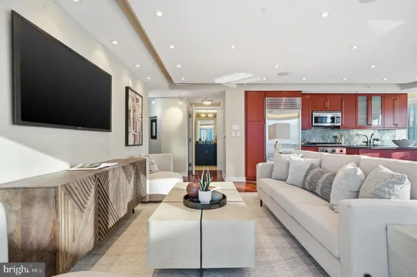 a living room with furniture and a flat screen tv