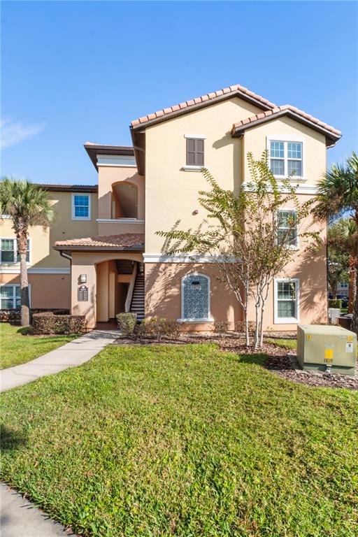 5475 Vineland Road, Unit 8302 Orlando, FL 32811 - Photo 1 of 12 a front view of a house with a yard