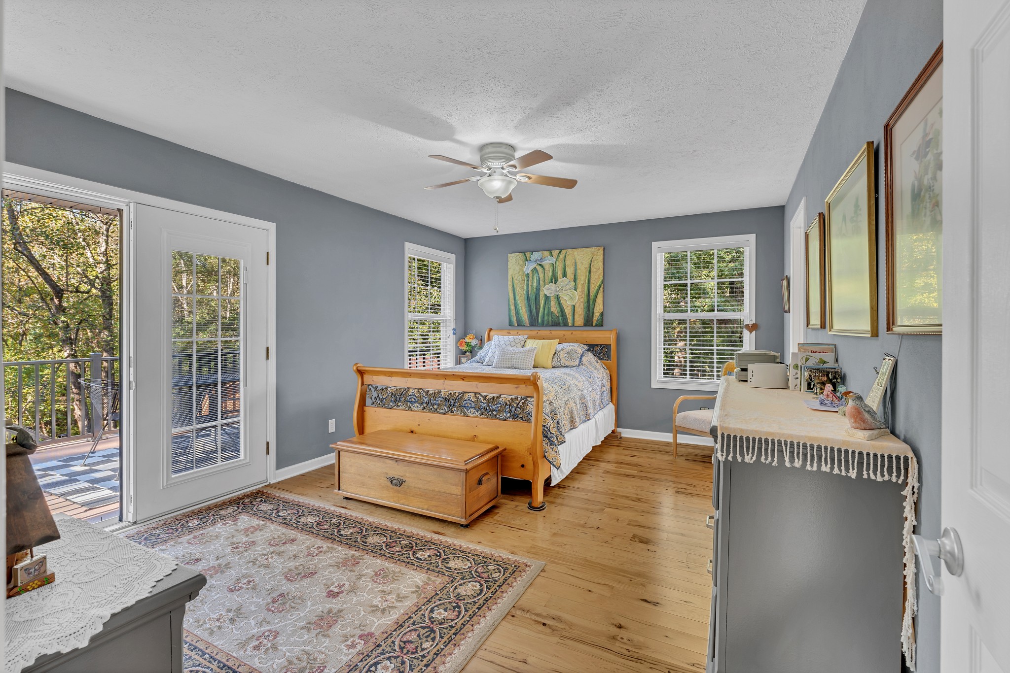 1475 Petty Road White Bluff, TN 37187 - Photo 14 of 55 a spacious bedroom with a large bed and a chandelier